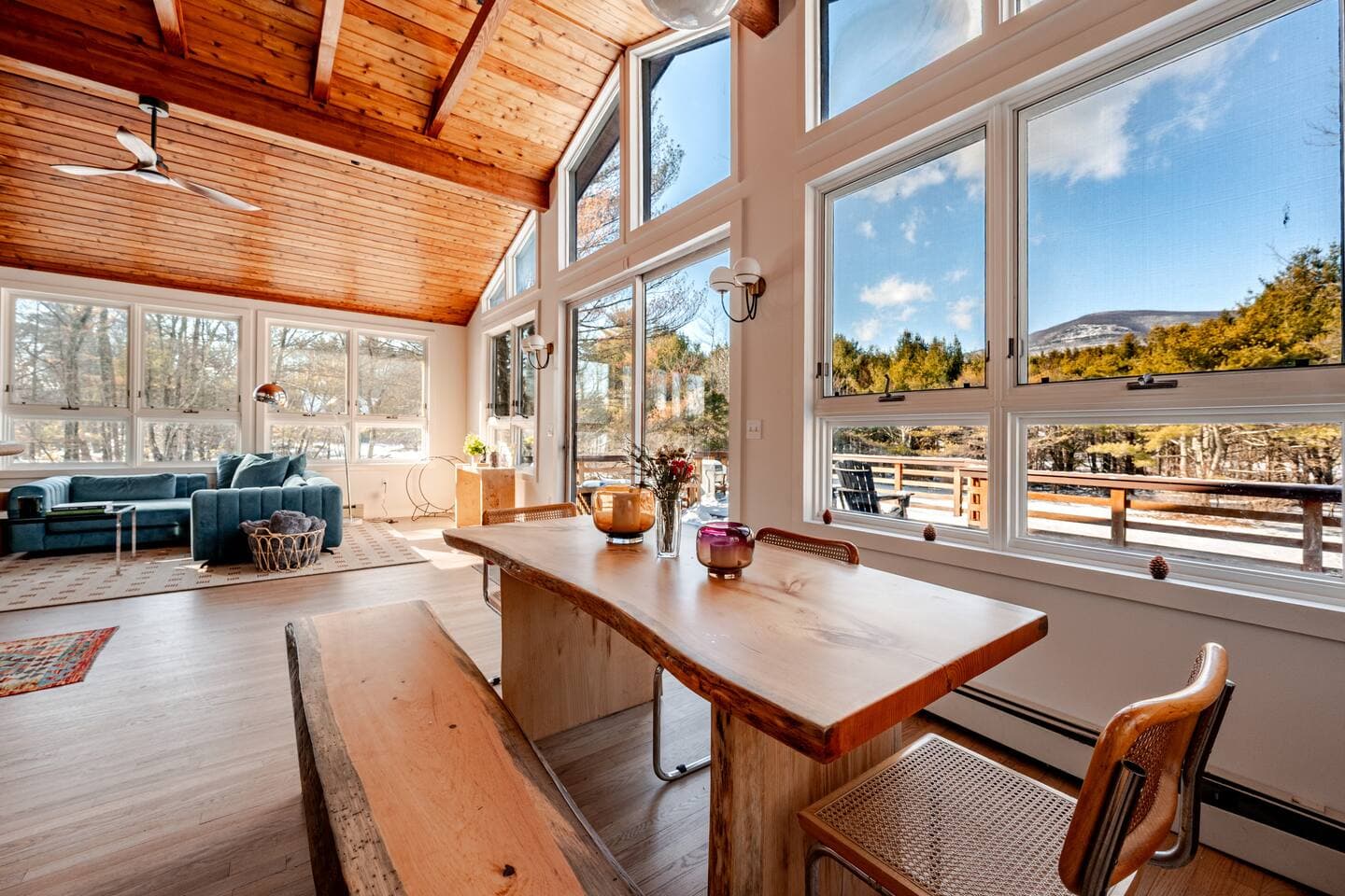 Dining area with live-edge wood table and Overlook Mountain views at The Cedar Stock Cabin